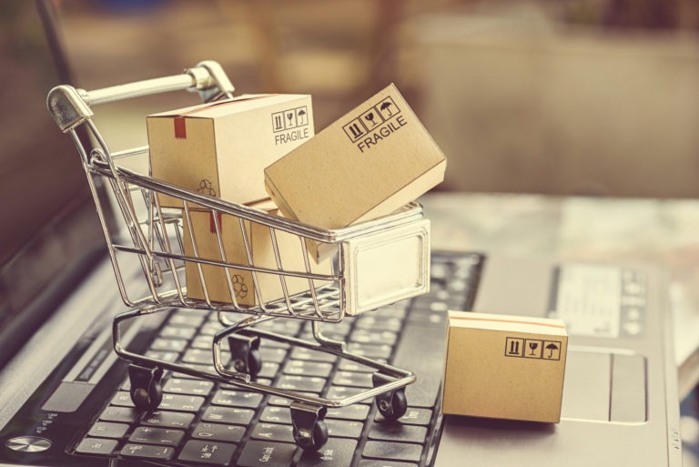 small trolley on laptop with boxes