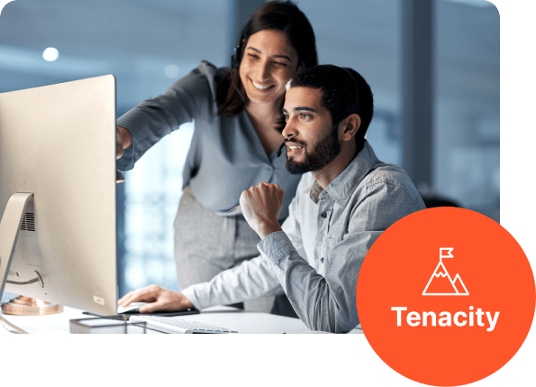 Woman and man looking at computer screen