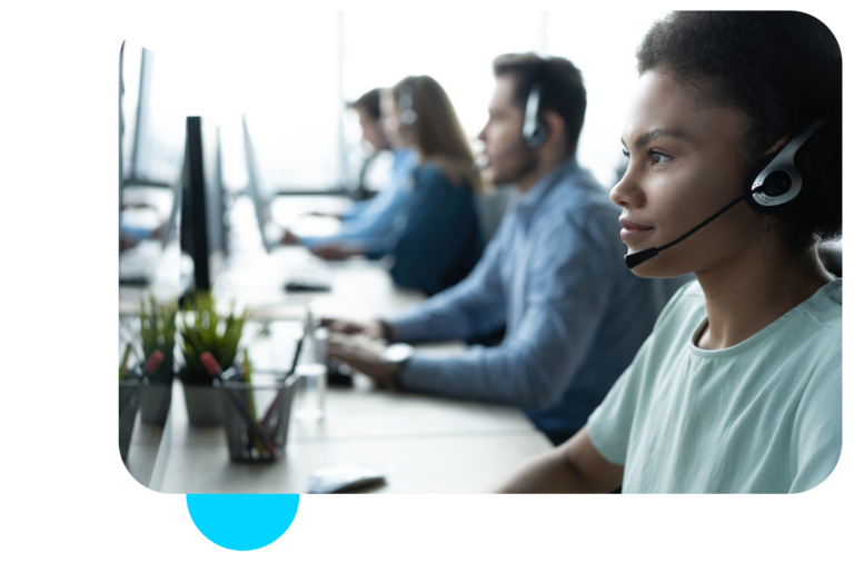 Woman behind computer working to help customers