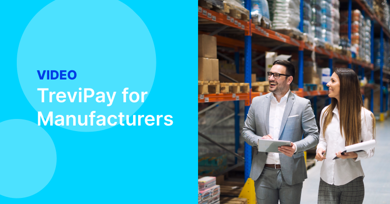Man and woman walk in manufacturing warehouse discussing TreviPay B2B Payments and Invoicing