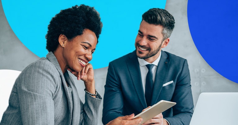 man and woman talking in office