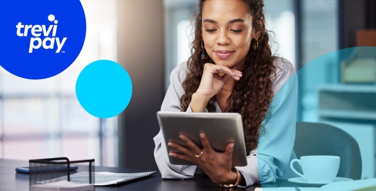 woman at ipad working and smiling