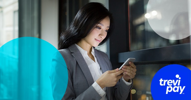 photo of woman looking at lit up mobile smiling with TreviPay branding