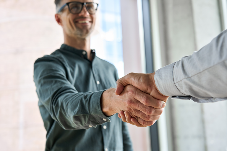 below view of 2 men shaking hands