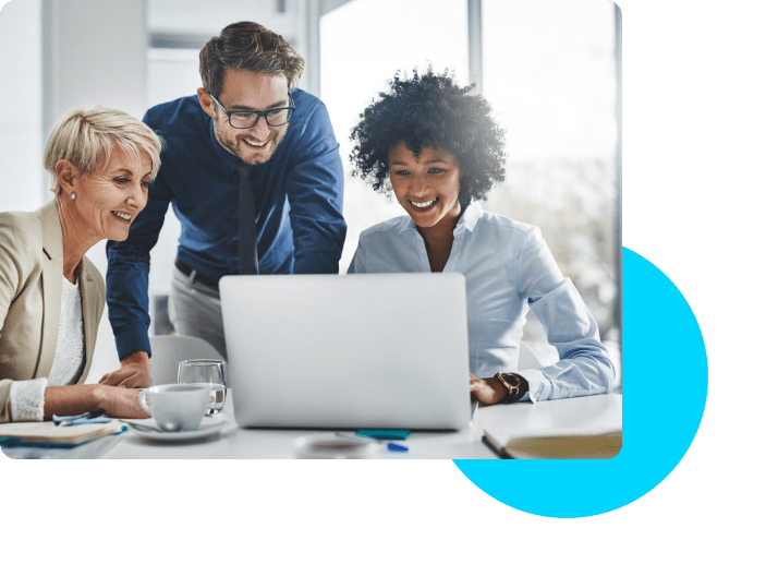 3 people looking at a laptop and smiling with a blue circle in the corner