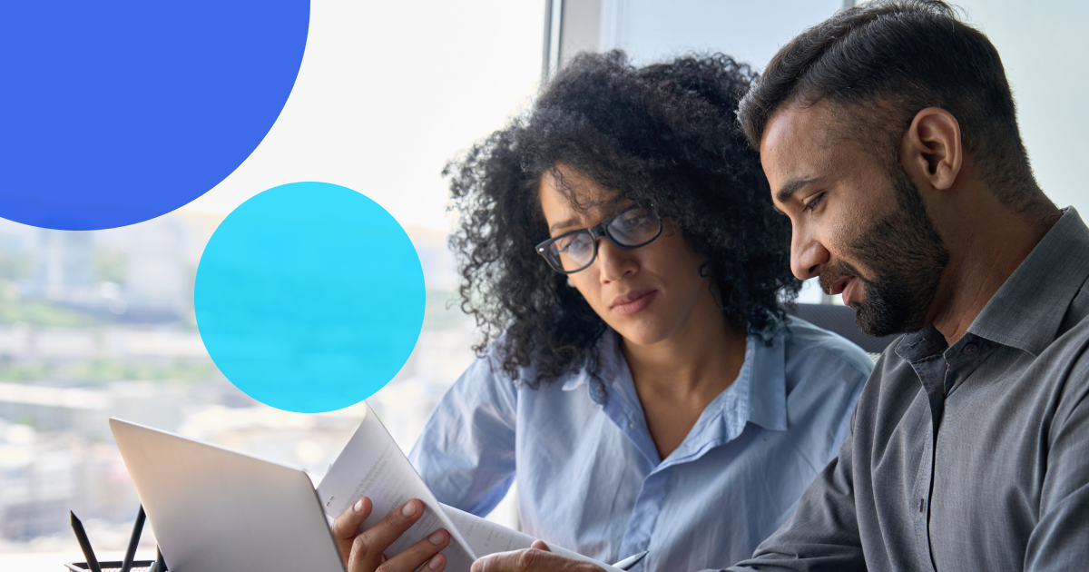 Two business people looking at the hidden costs of managing trade credit in-house.